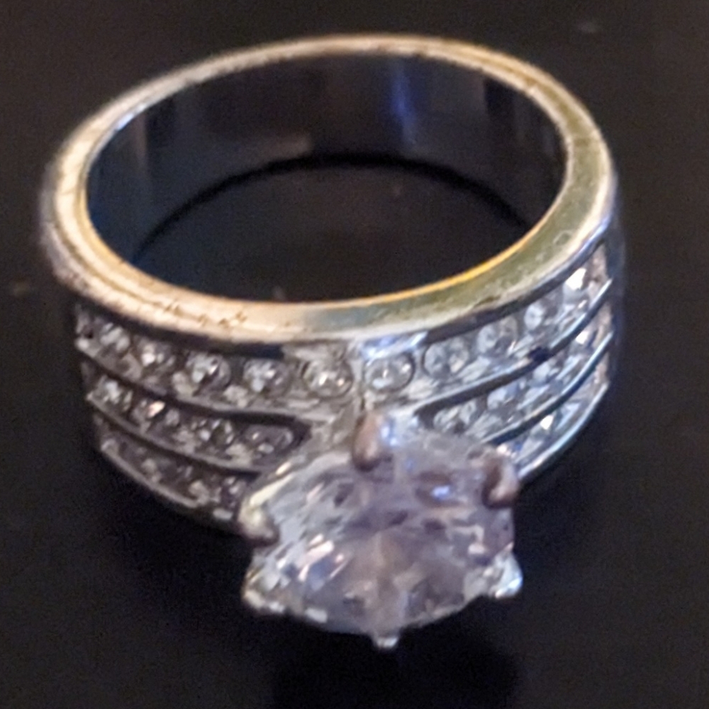 1 Kt Moissanite Gemstone set into a Ring w/30 more Stones